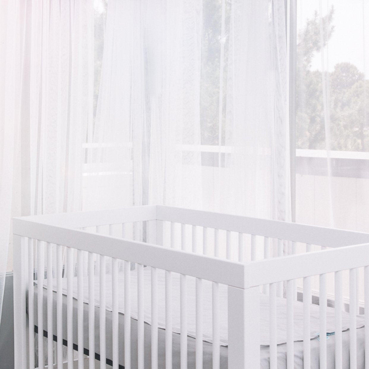 QuickZip crib sheets in multiple colors and patterns for nursery decor.