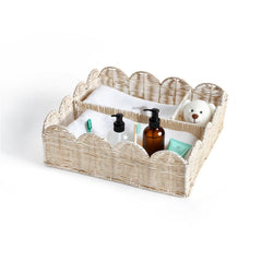 Quincry rattan divided basket with four compartments for organized baby items.