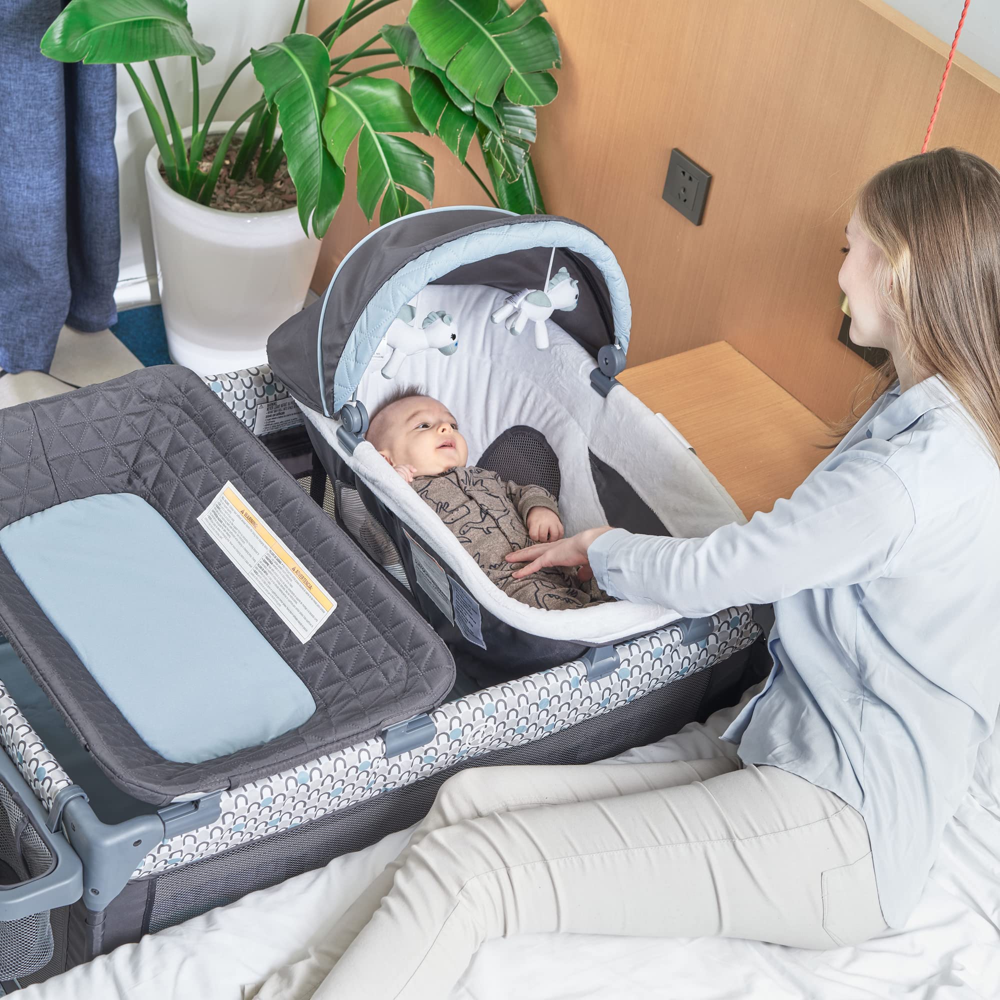QUTANIX changing table and storage shelf integrated in the unit.