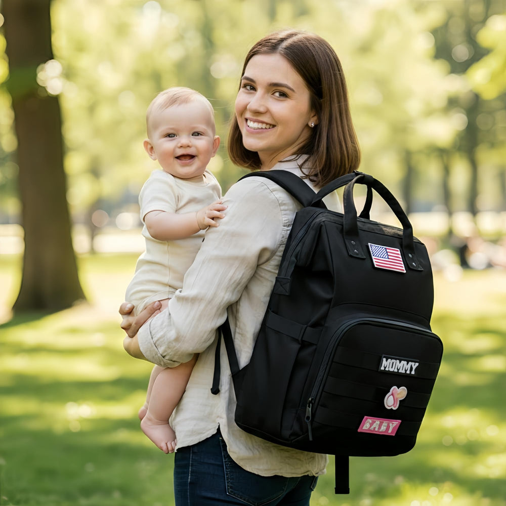 QWREOIA diaper bag backpack spacious pockets for organized travel.