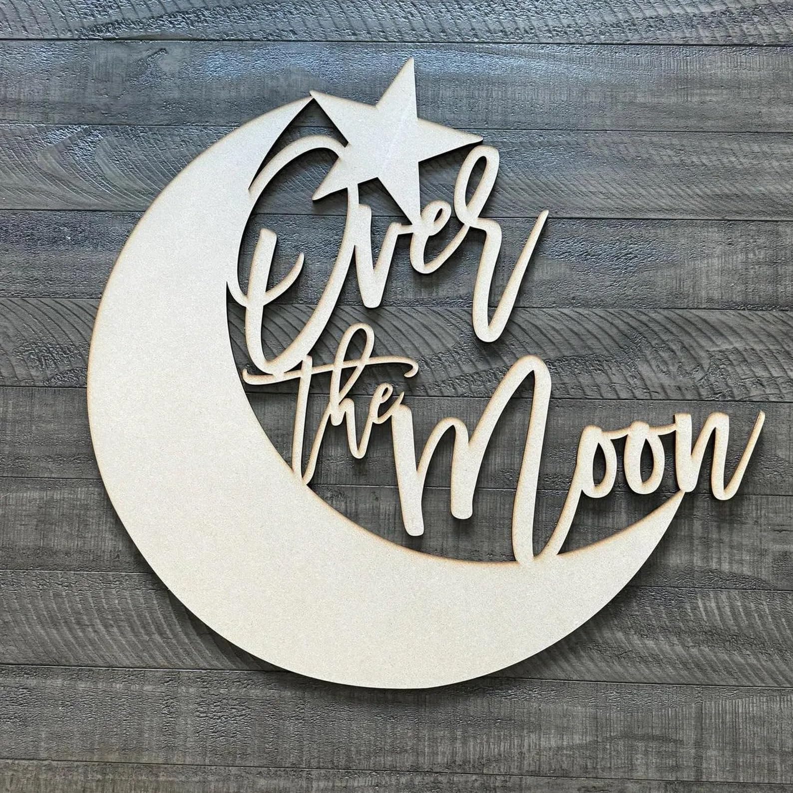 QWTOWFM Over The Moon sign backdrop in warm wood for rustic photo moments.