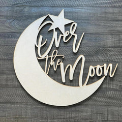 QWTOWFM Over The Moon sign backdrop in warm wood for rustic photo moments.