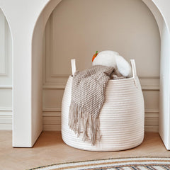 R RUNKA basket holds blankets and plush pillows without losing its shape