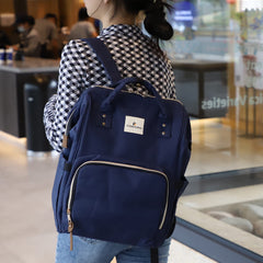Ramhorn blue diaper bag backpack with side pocket for bottles.