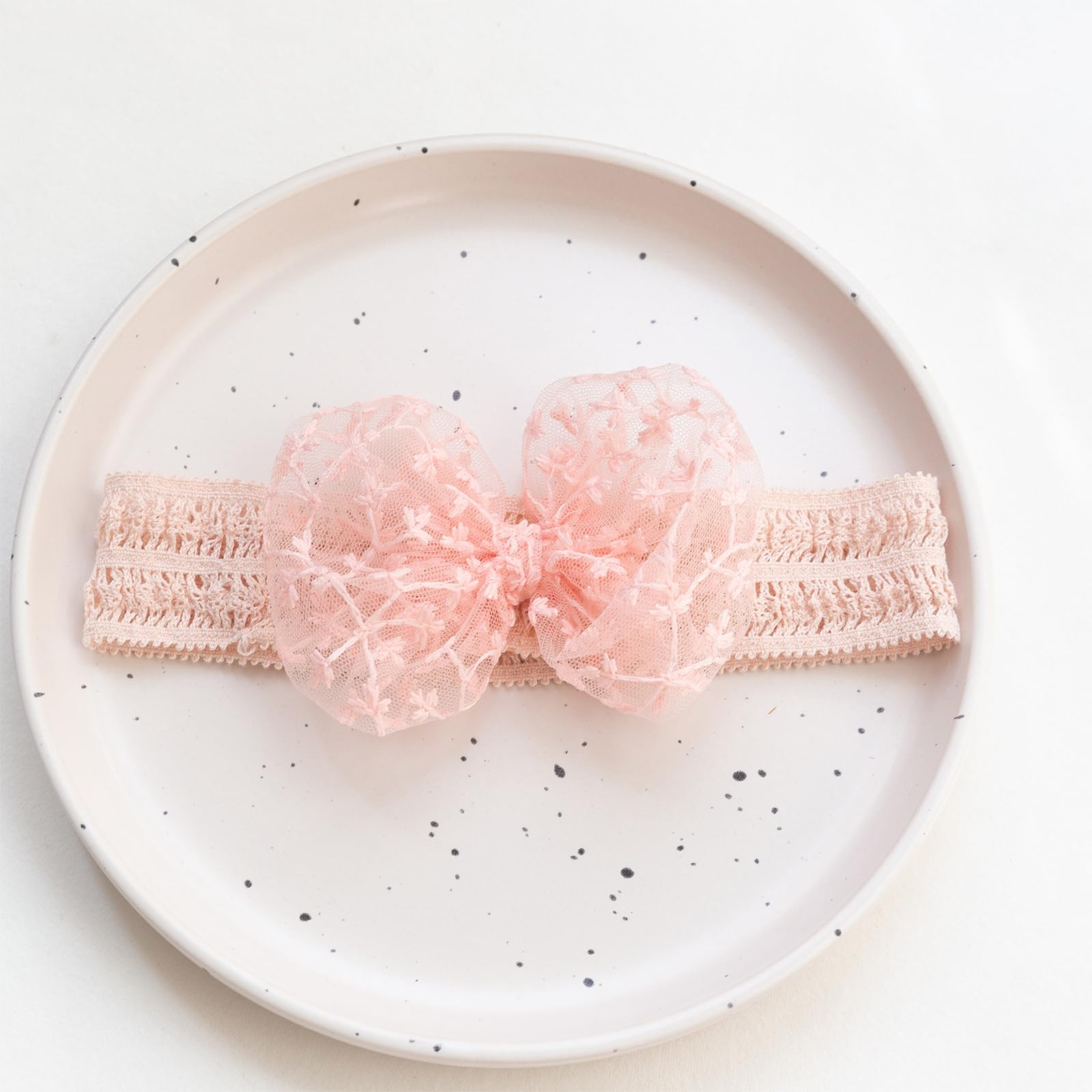 Rannyrena baby turban flower headband emphasizes cute style for photos.