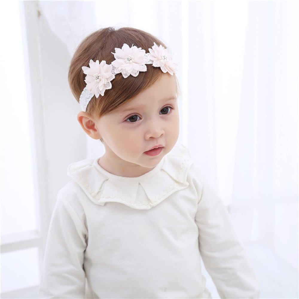 Rannyrena floral lace headband with pink flowers keeps baby's hair neatly in place.