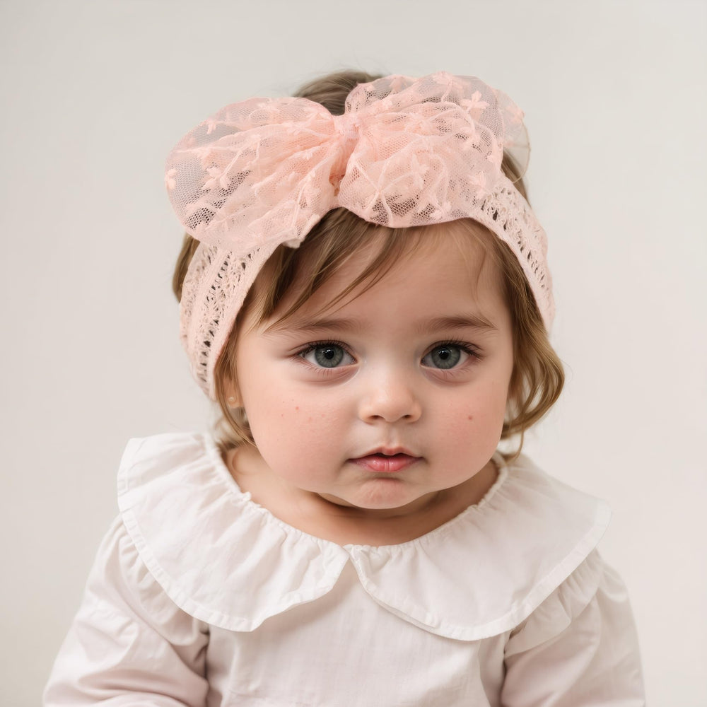 Rannyrena newborn to toddler headband fits growing heads with soft stretch.