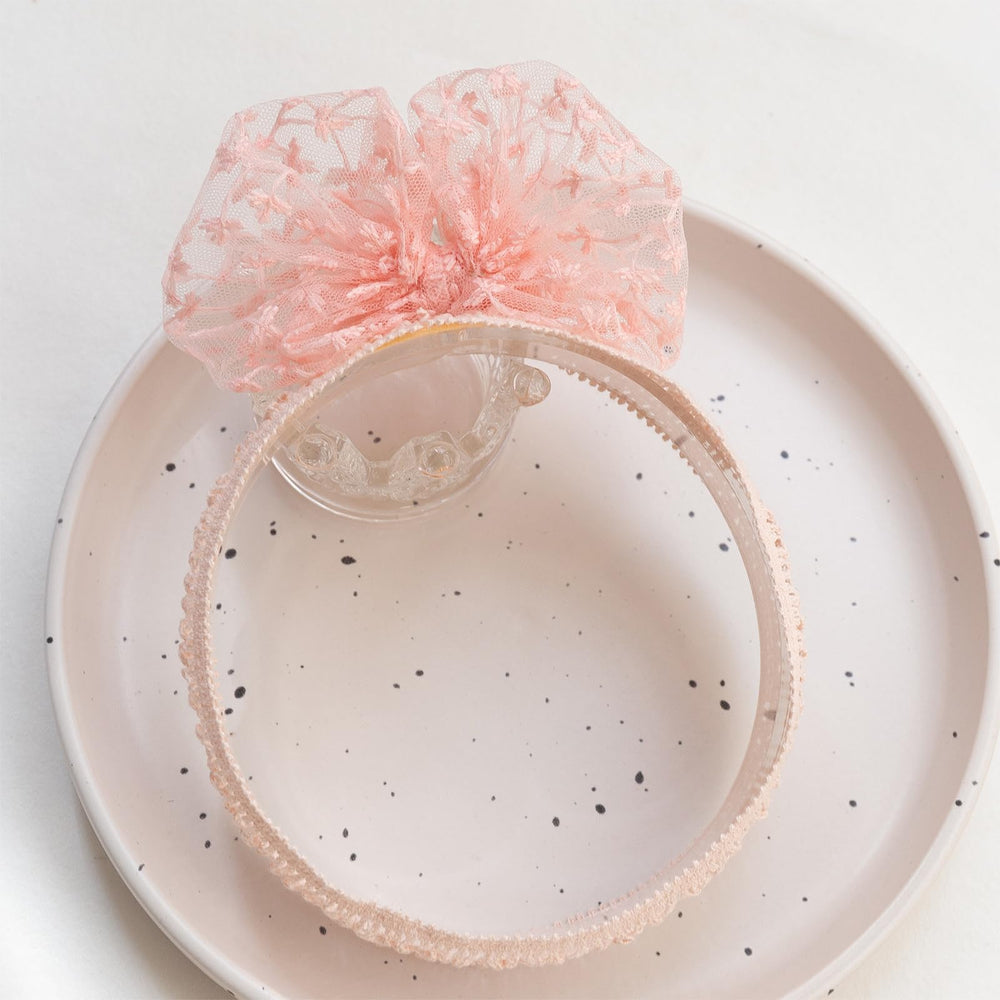 Rannyrena soft-elastic headband for babies ensures snug, gentle fit.