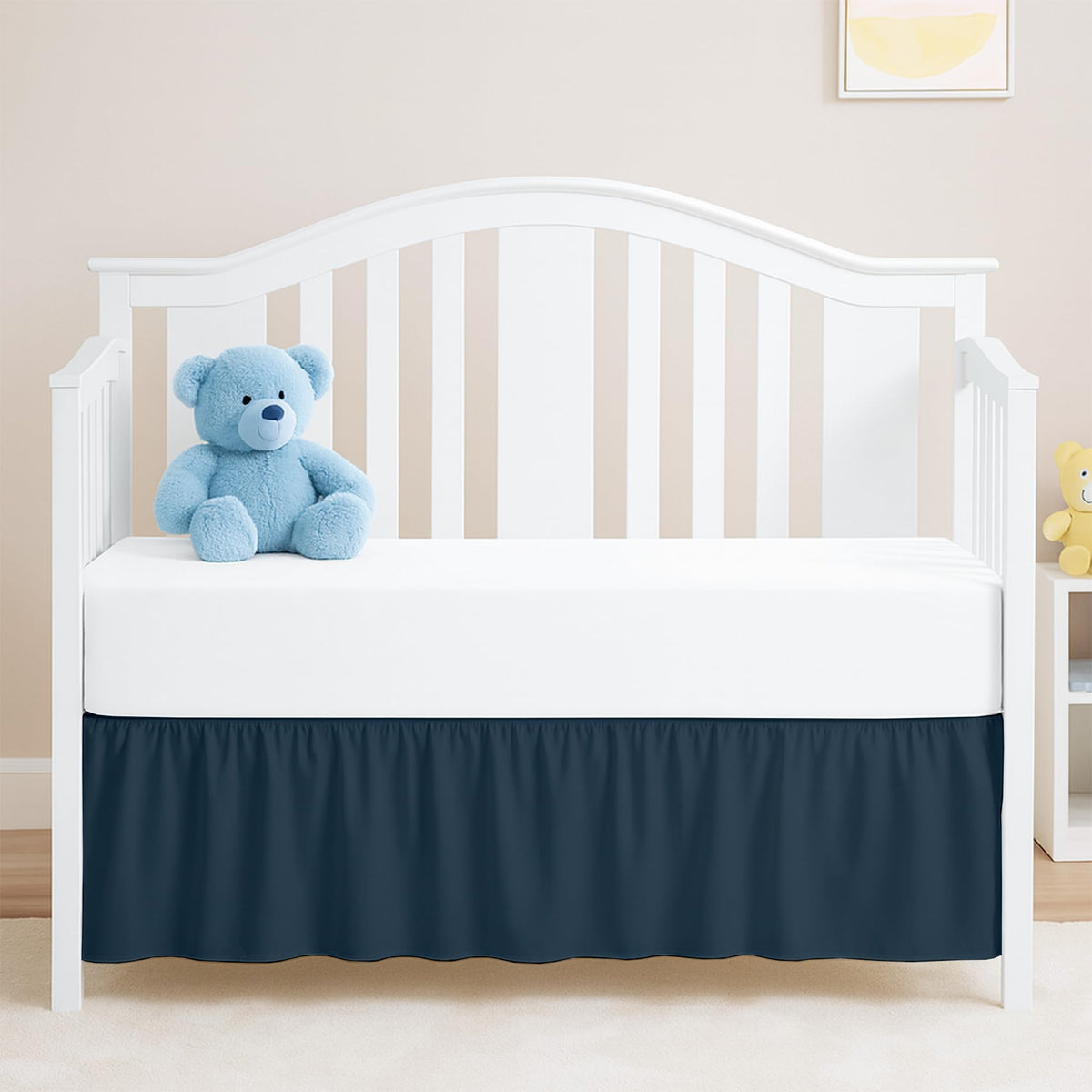 Ready To Rest navy blue crib skirt with 14-inch drop hides under-crib storage and finishes the nursery look