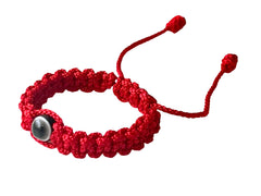 Red Bracelet for Babies on newborn wrist, adjustable size