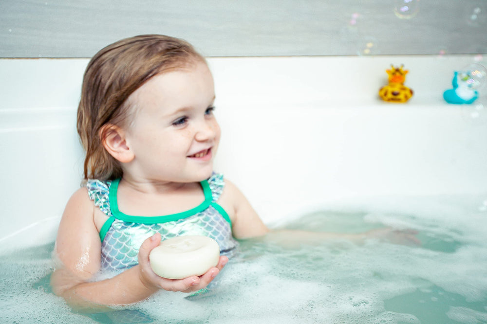 Relaxcation Cocoa Butter closeup highlights moisturizing softness for baby's skin.