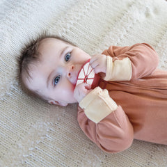 Relive ergonomic teething ball for newborns, supports grasping and fine motor play.