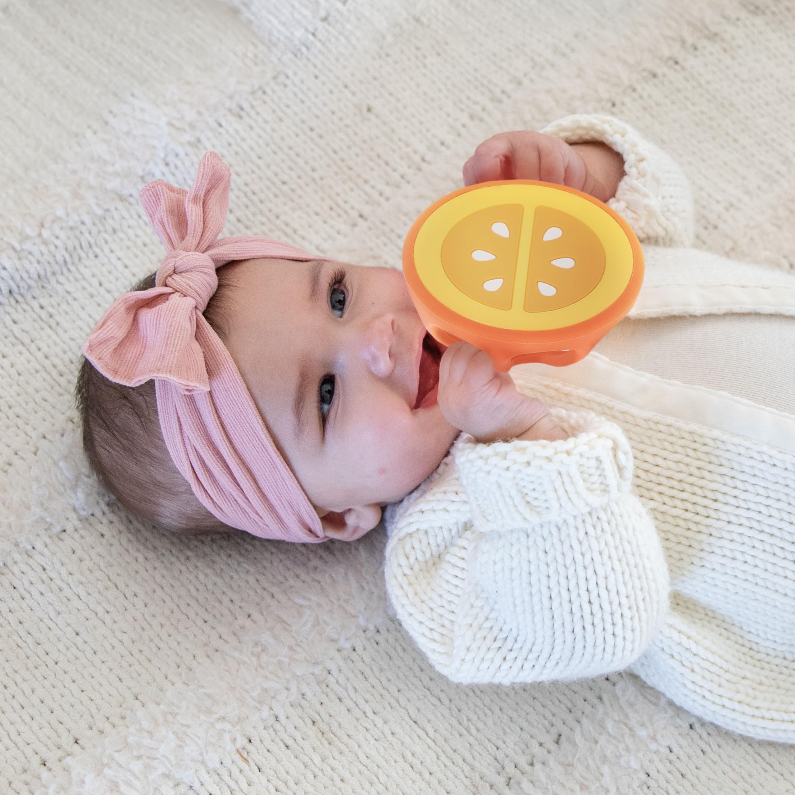 ReLIVE silicone teether features bright design for visual and tactile stimulation.