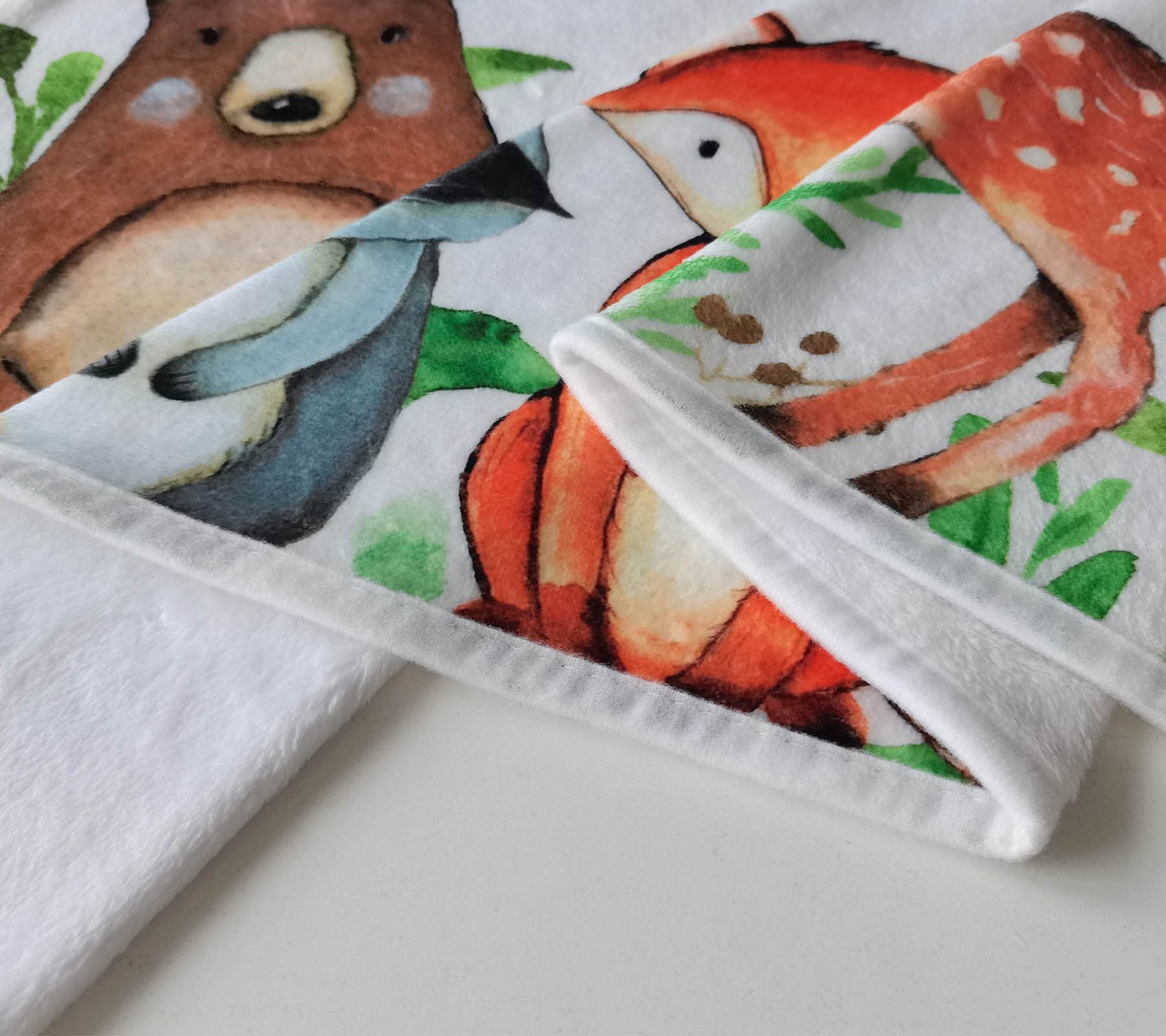 RICEFINE Woodland milestone blanket promotes easy age tracking in photos.