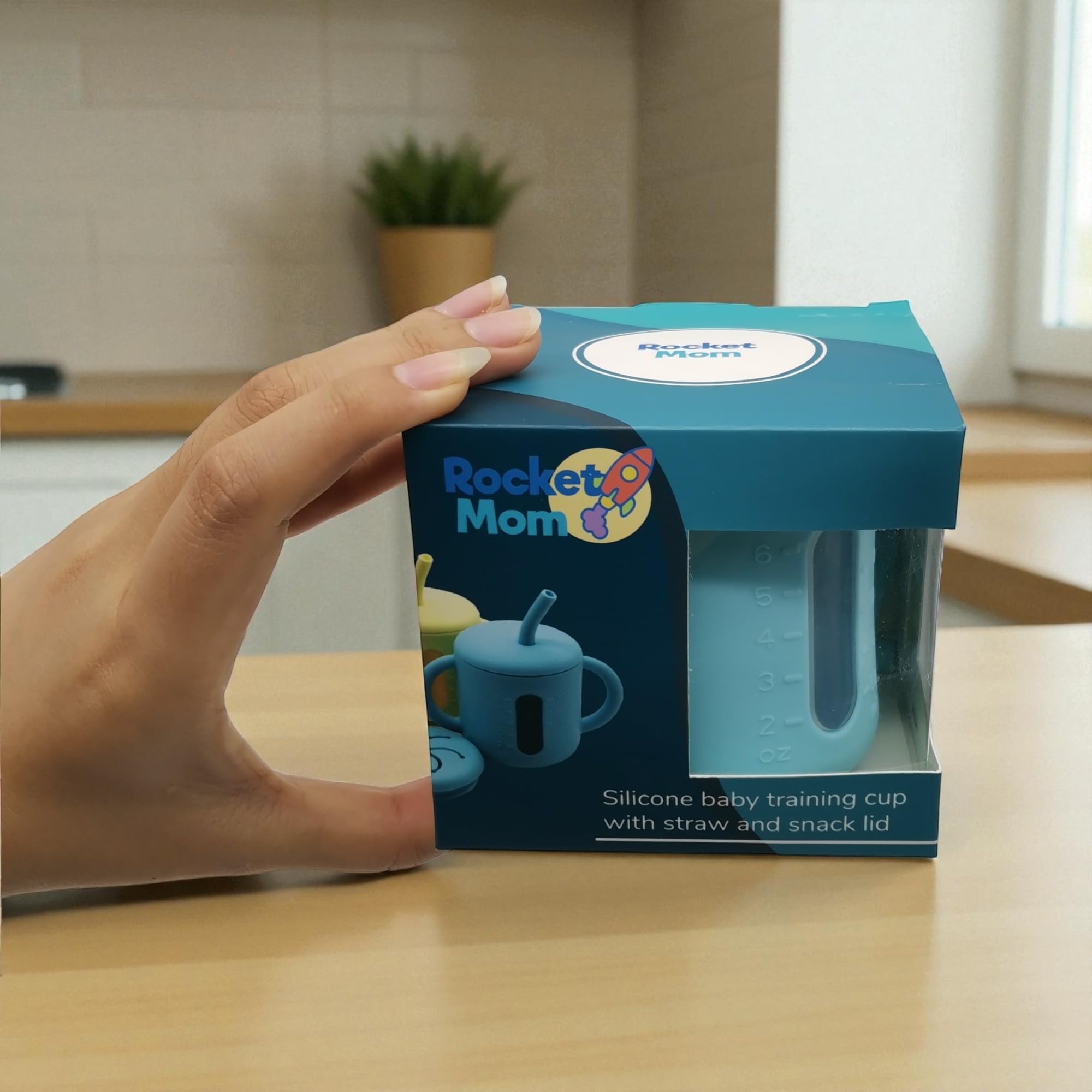 Rocket Mom soft-grip cup supports tiny fingers during self-feeding.
