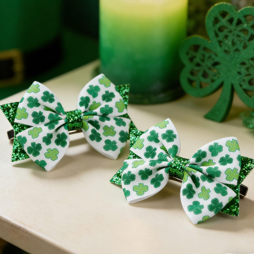 Roffiy four-leaf clover bow clip worn with a ponytail for St Patrick's Day.
