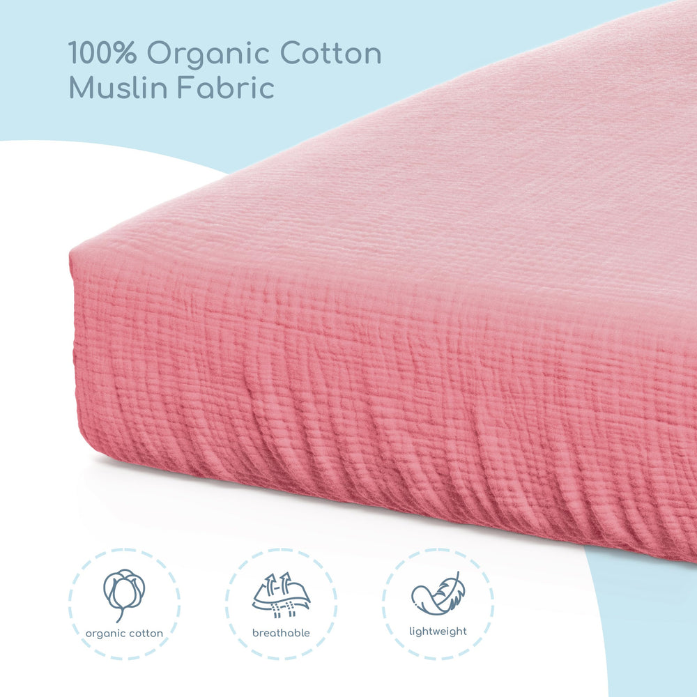 ROMY RO muslin crib sheet in neutral pale rose design for any nursery.
