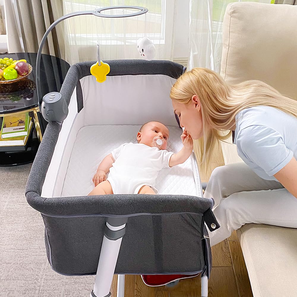 RONBEI bassinet with a music box and toys for gentle stimulation.