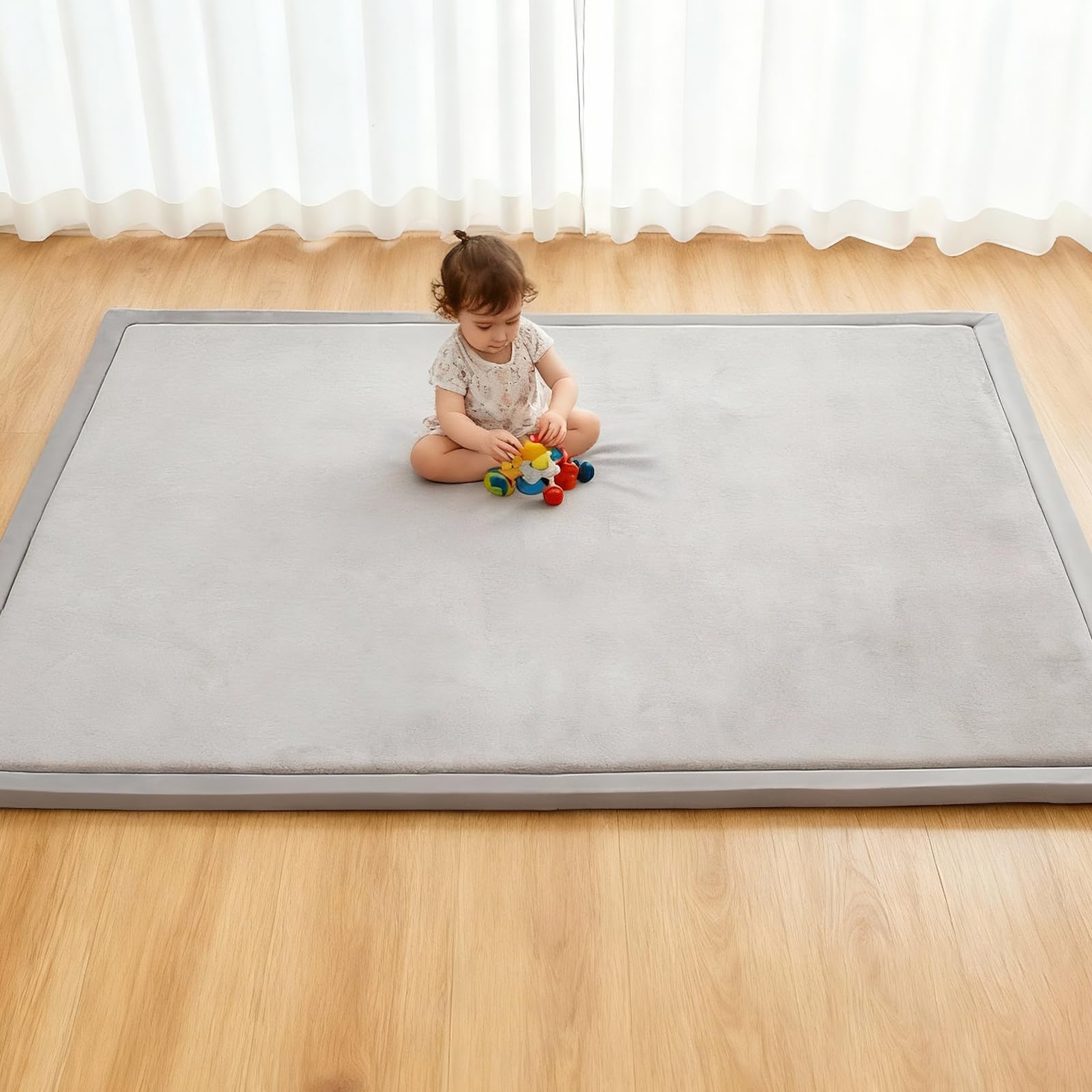 RONGFA baby play mat with memory foam padding for cushioned tummy time.