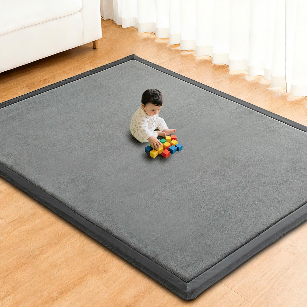 RONGFA baby play mat with memory foam padding for cushioned tummy time on hard floors.