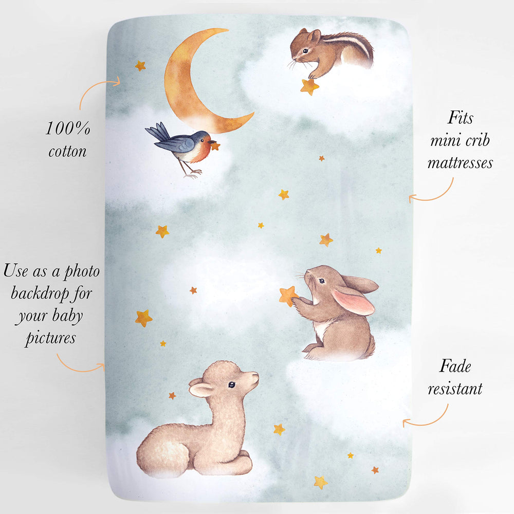 Rookie Humans crib sheet watercolor artwork adds soft, dreamy backdrop to baby pictures.