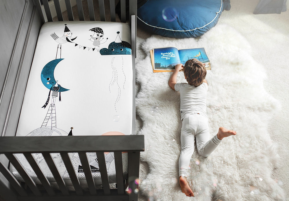 Rookie Humans Moon's Birthday gender-neutral design complements any nursery style.