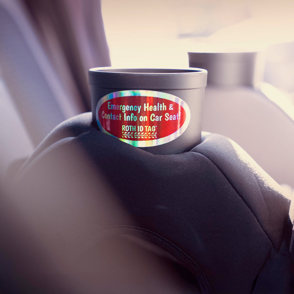 Roth ID Tag on car seat shows secure attachment and visibility.