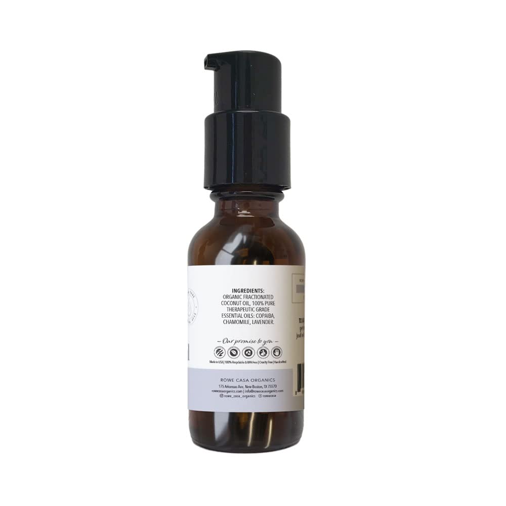 Rowe Casa Organics teething oil being massaged on baby's gums for gentle relief.