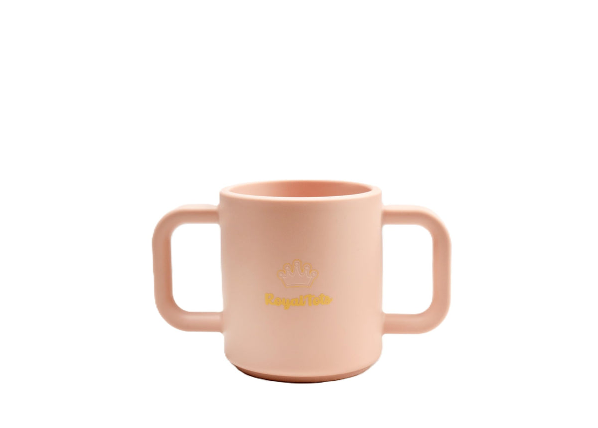 RoyalTots leak-proof pink cup for mess-free sips at home.