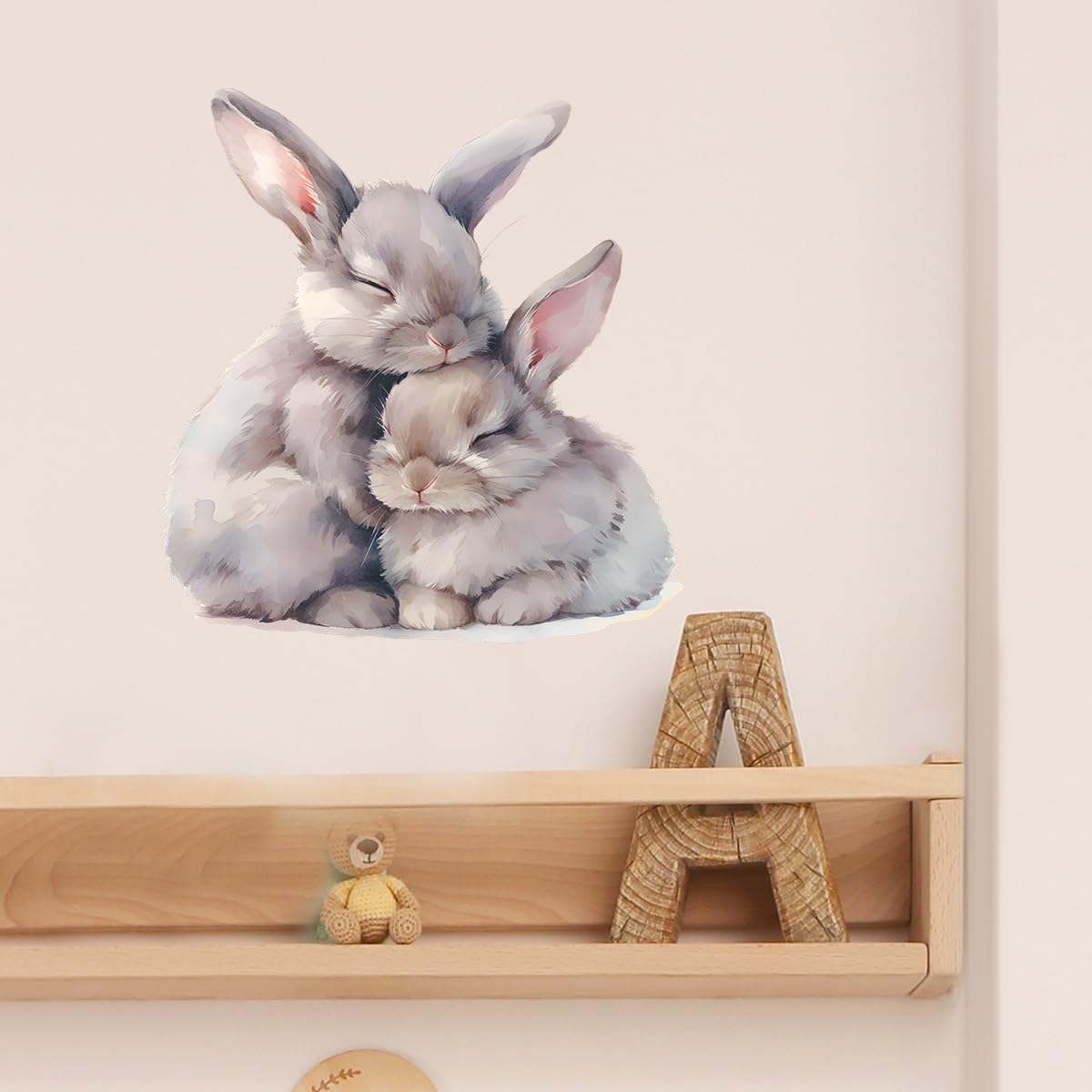 RoyoLam applying rabbits wall decals in a kids room setup
