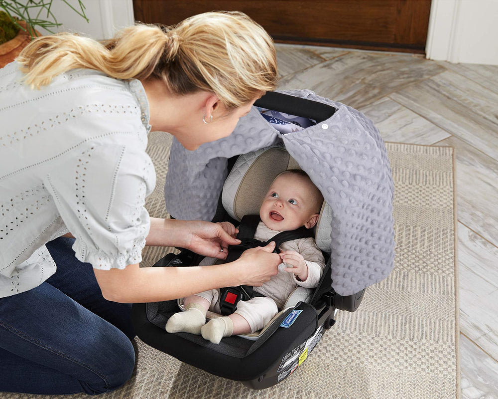 Rquite universal-fit canopy doubles as nursing cover for on the go feeds.
