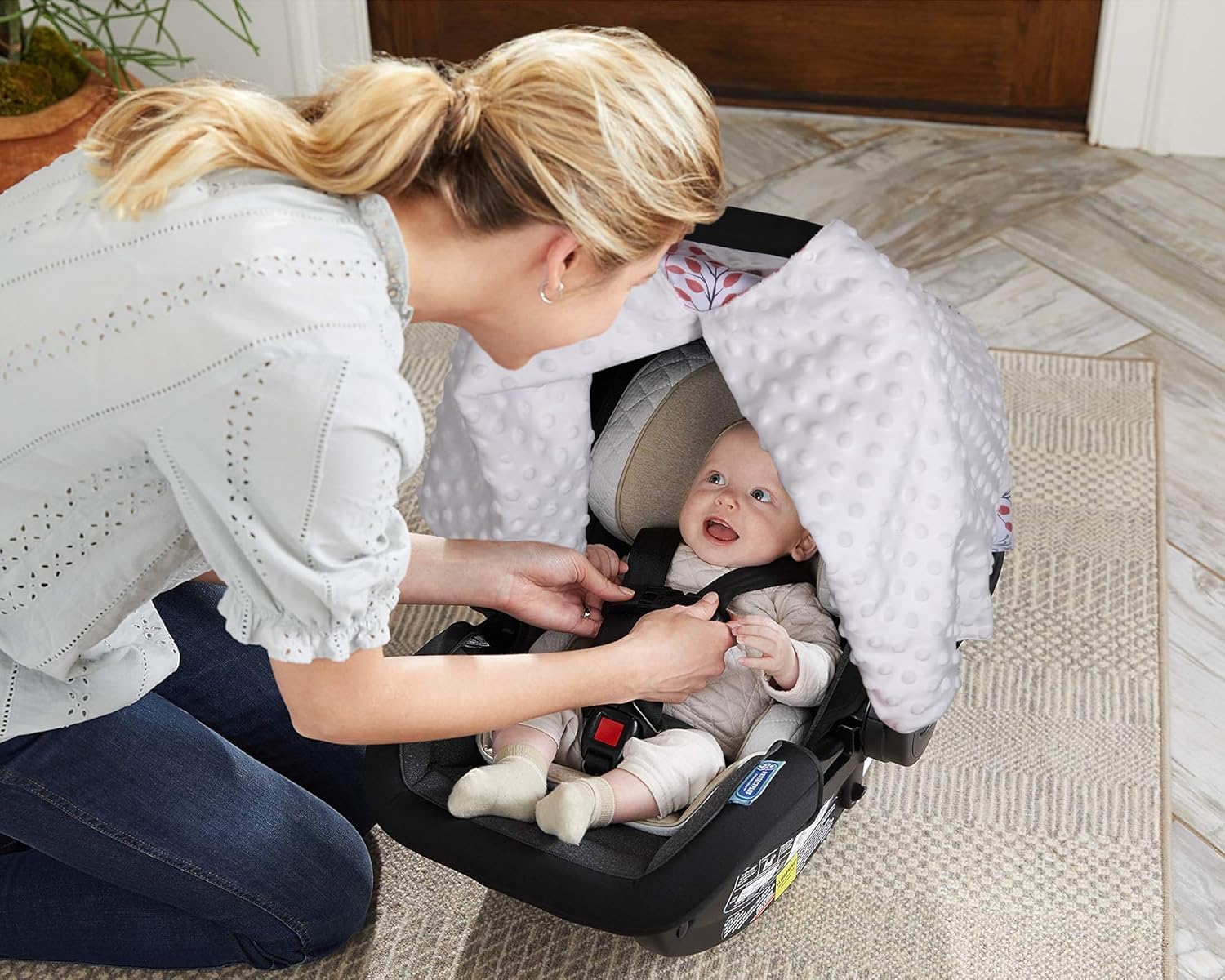 Rquite nursing cover doubles as discreet breastfeeding shield
