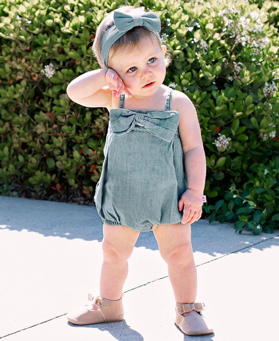RuffleButts denim headband worn by baby adds charm for parties and everyday wear.