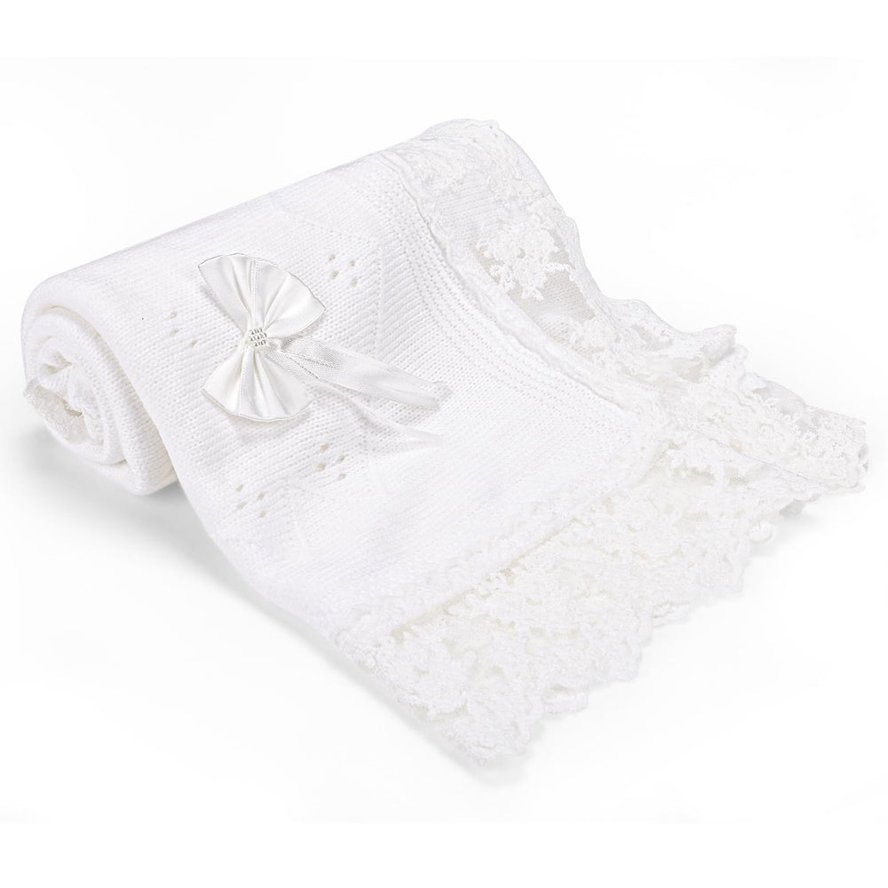 Runeaoys white knit blanket showing soft, cozy material for newborn comfort.