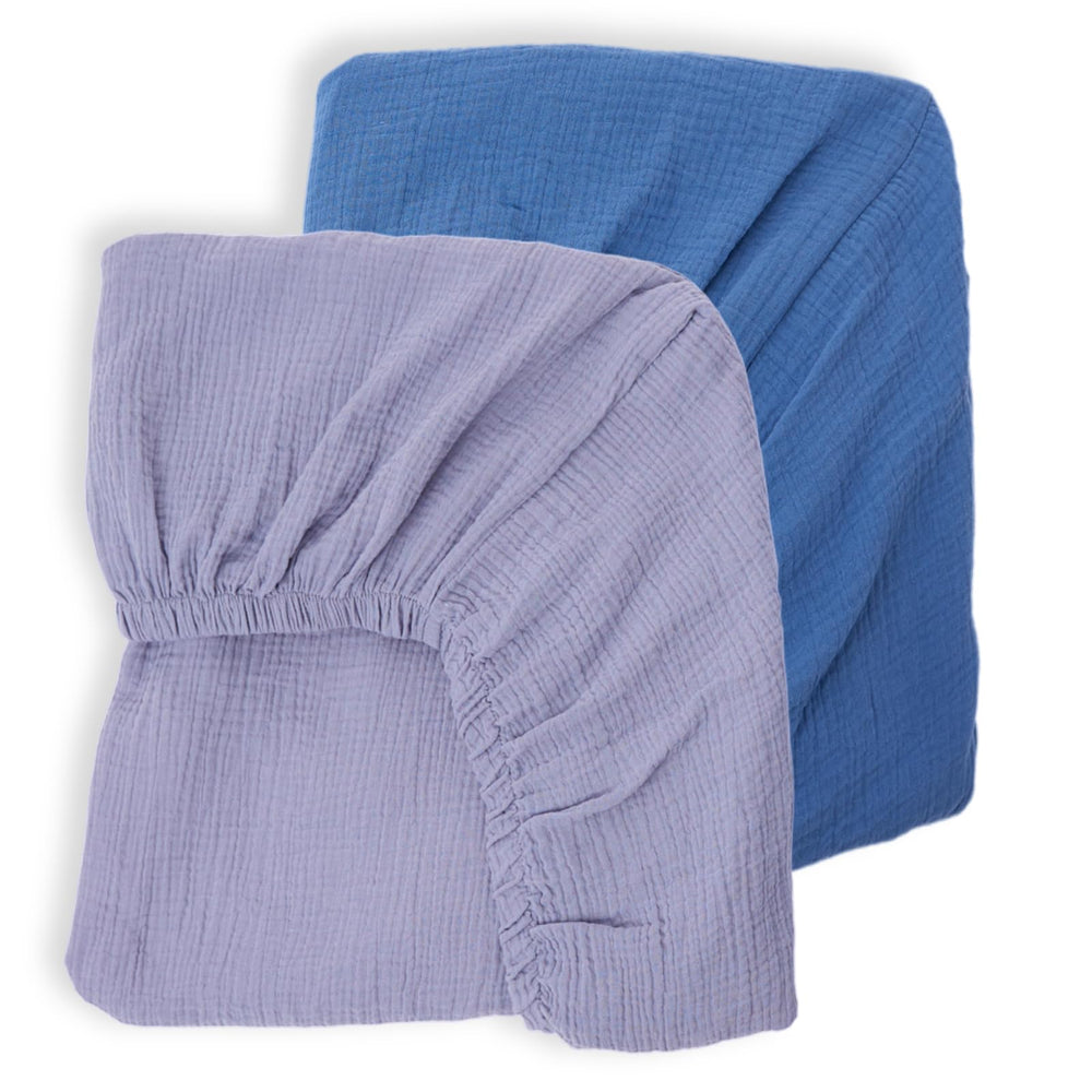 Rutiwa muslin crib sheets blue pack resting on a crib mattress for gentle sleep.