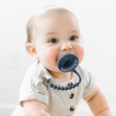 Ryan & Rose Cutie PAT Flat teether with clip: keeps pacifier within reach.