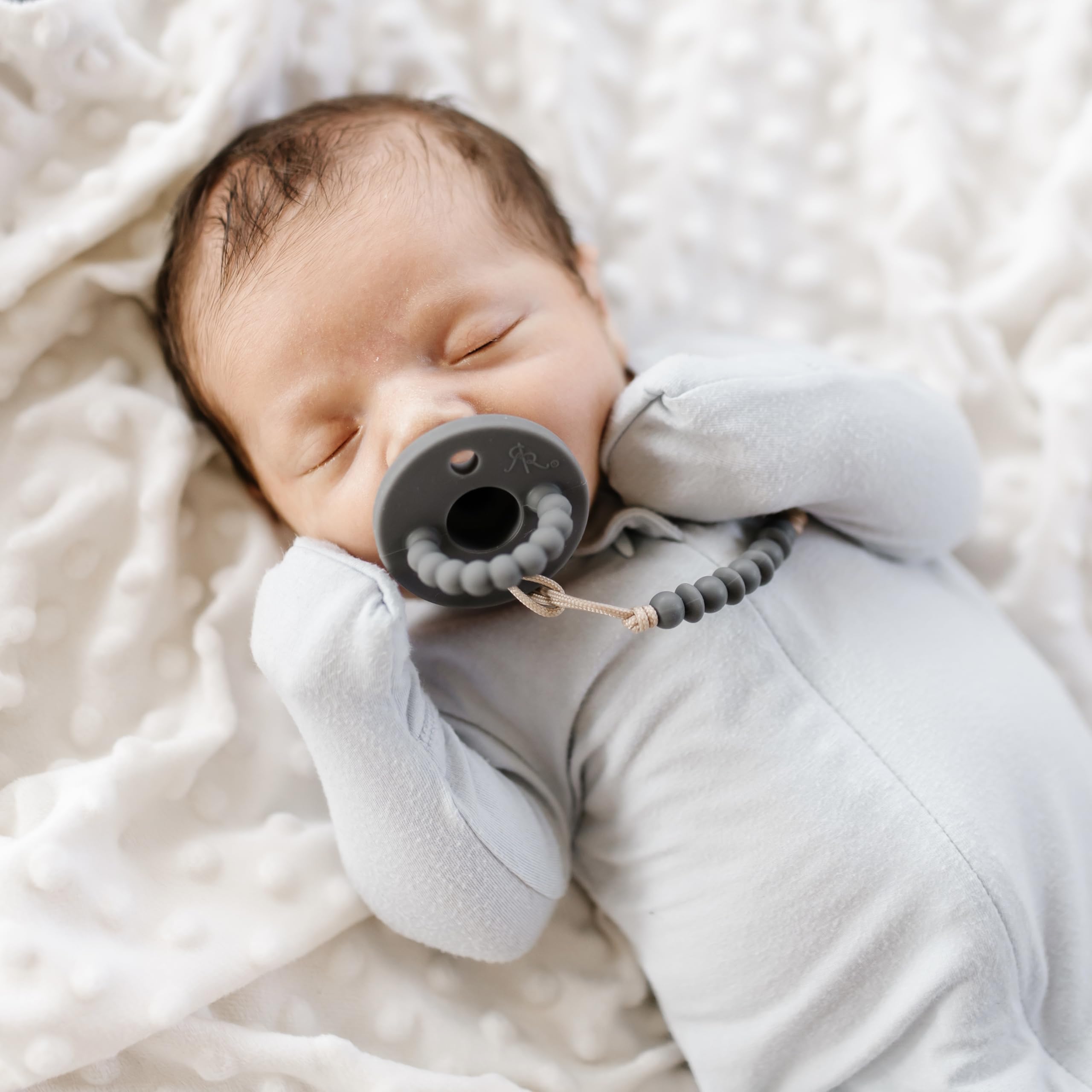 Large shield teether portion supports teething and easy breathing.