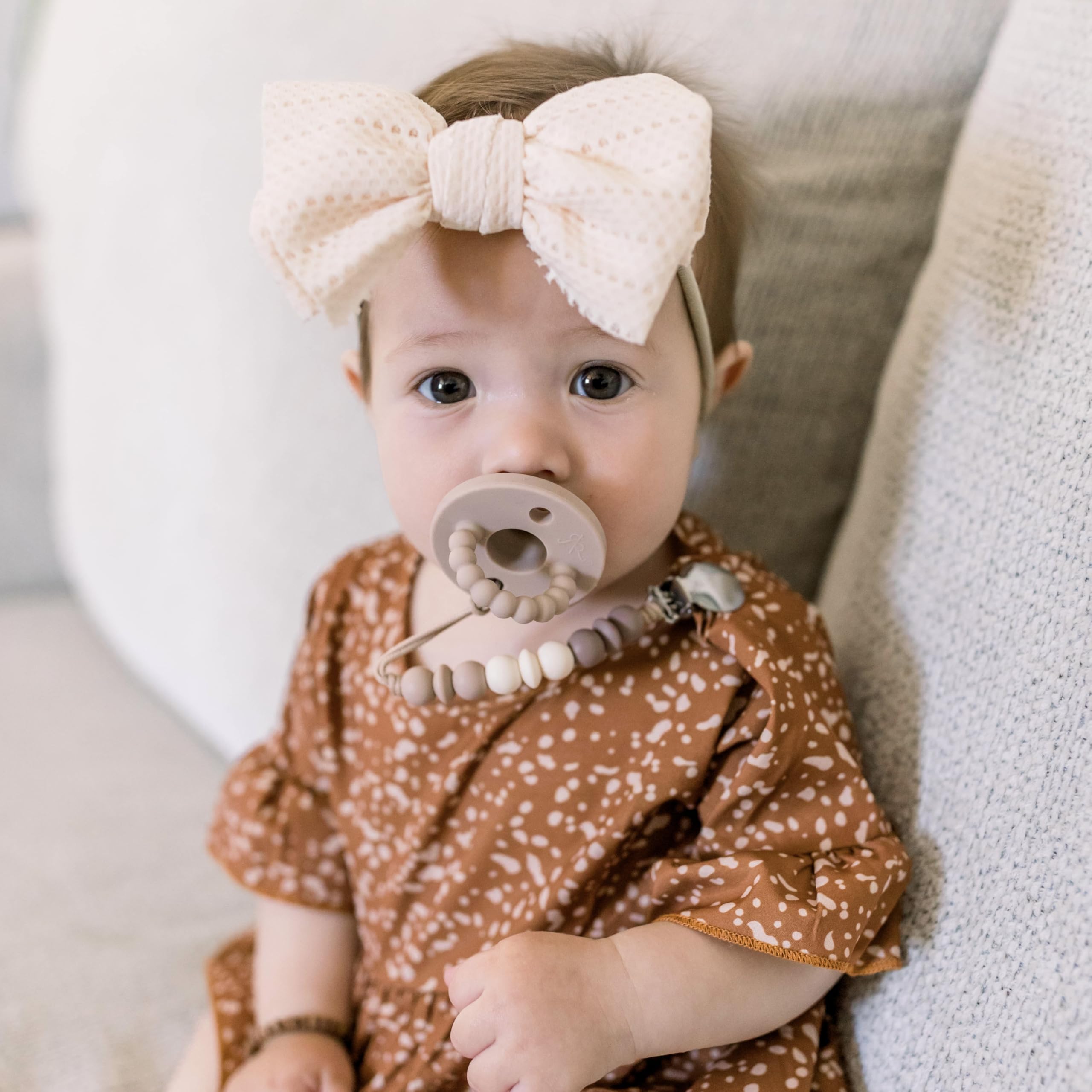 Teether handle designed for easy grip and comfort during use.