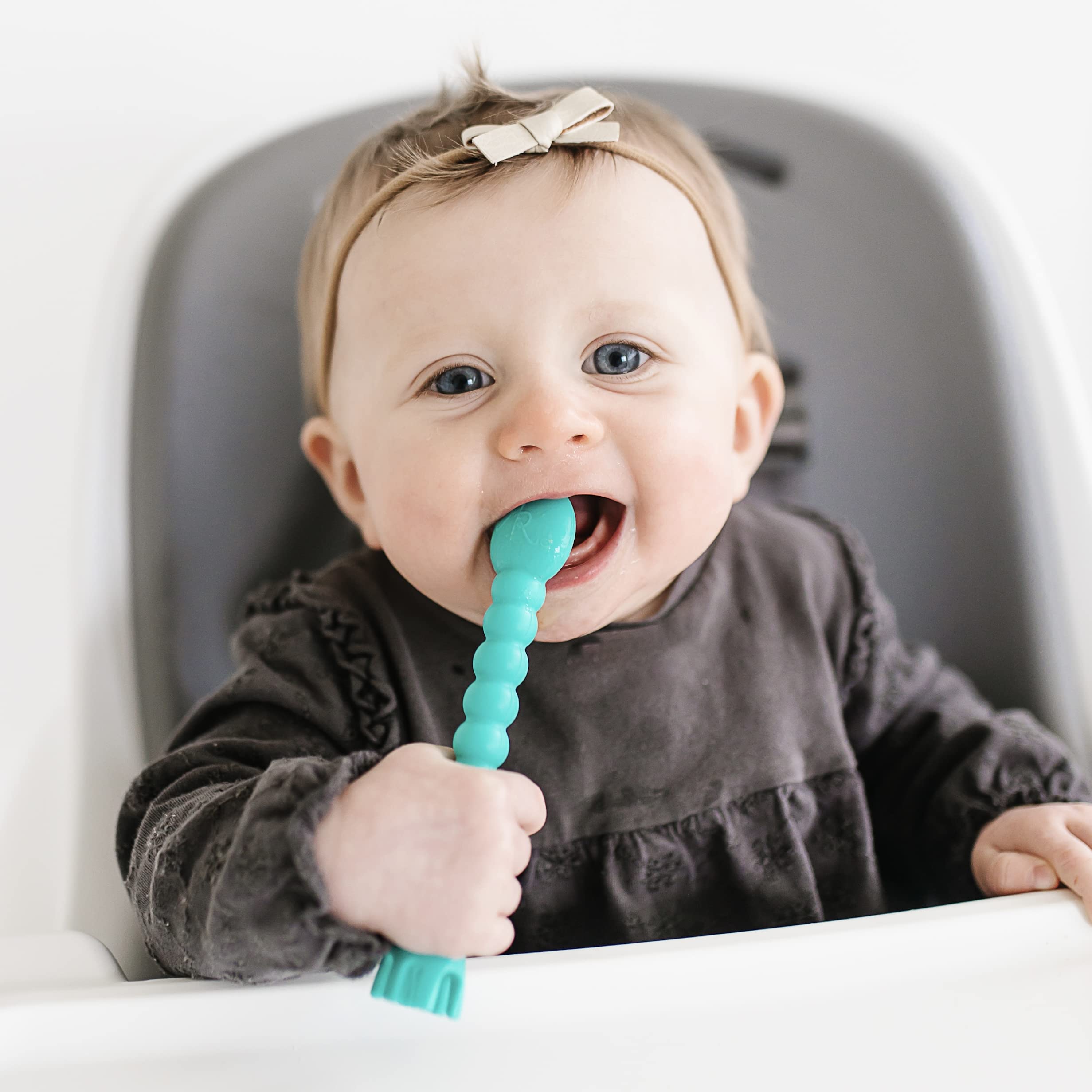 Soft silicone Cutie Tensil gentle on tender gums in turquoise