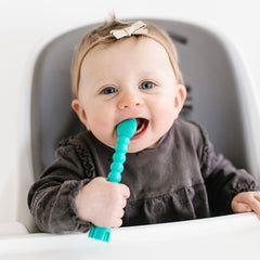 Soft silicone Cutie Tensil gentle on tender gums in turquoise
