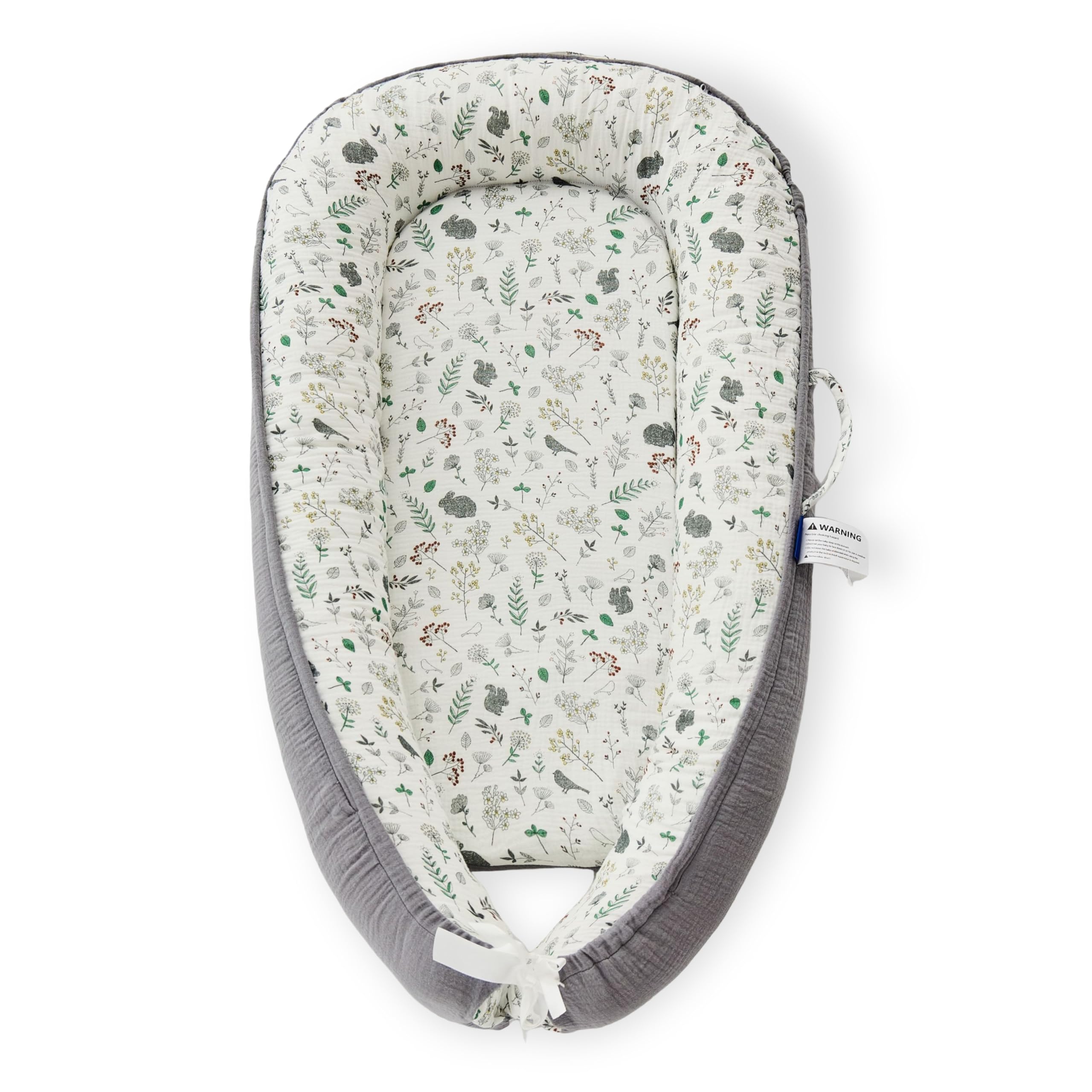 RYXTHALA premium muslin baby lounger folded for travel convenience.