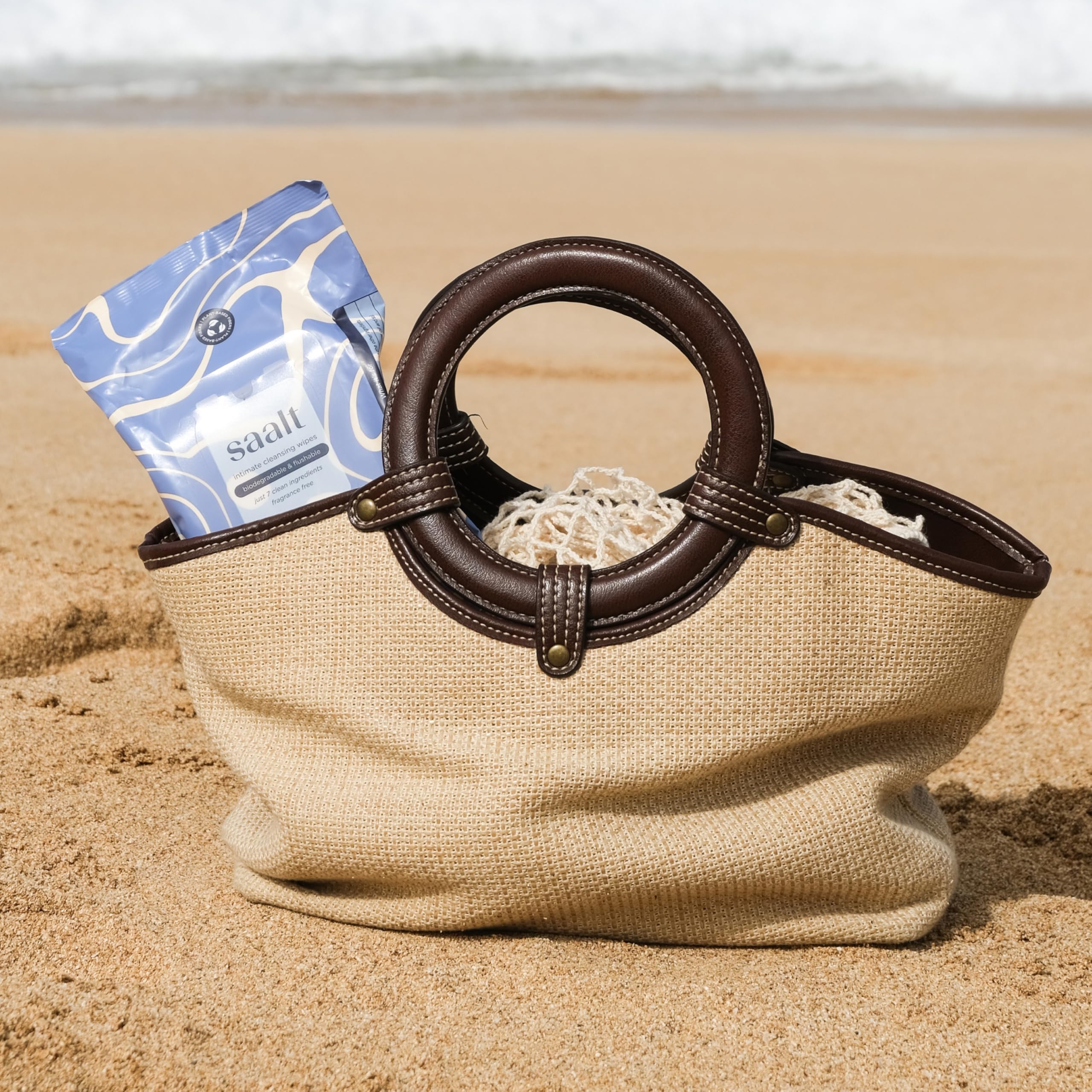 Saalt Daily Cleansing Wipes on-the-go use demonstrates practical skincare during travel or workouts.
