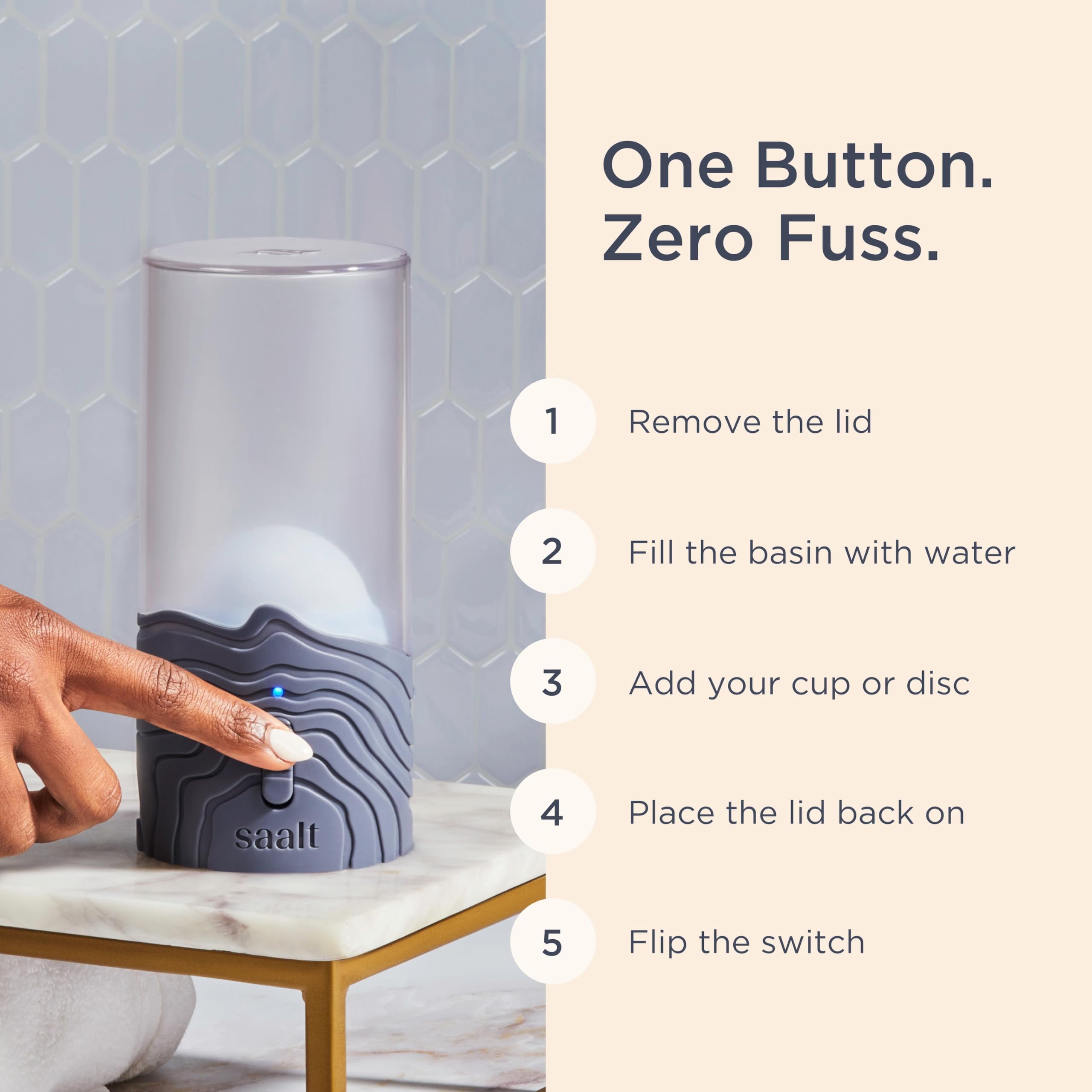 Saalt Menstrual Cup Steamer Blue Dusk, sleek compact design on a bathroom counter.
