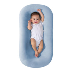 Saanerueen baby lounger in blue full view showing a cozy newborn nest