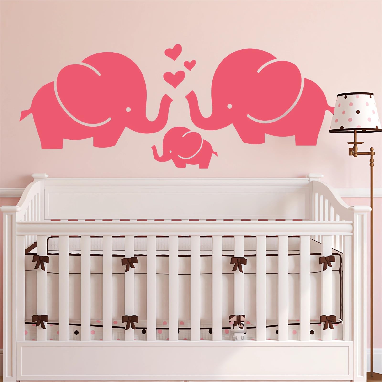 Sacinora pink baby elephant family wall sticker decorates a nursery wall with playful charm.