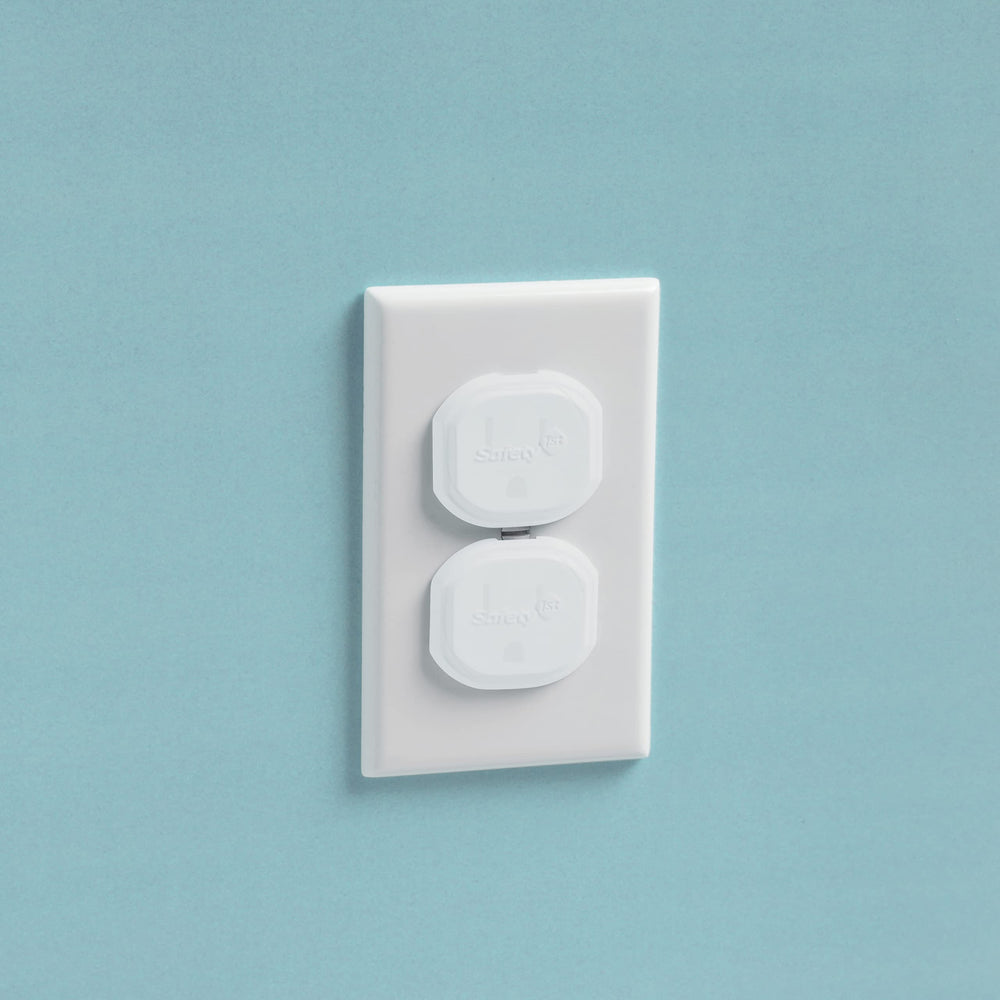 Safety 1st Secure Press plug protectors kit shown in packaging, easy to install across rooms for consistent safety.