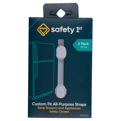 Safety 1st Custom Fit strap secured to cabinet with adhesive for childproofing.