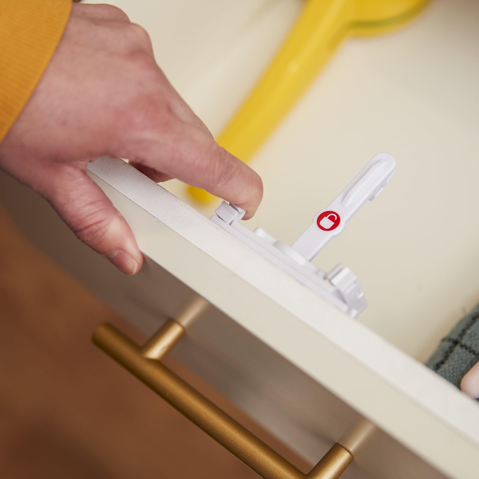 Safety 1st adhesive locks fit many cabinet styles for adaptable childproofing.