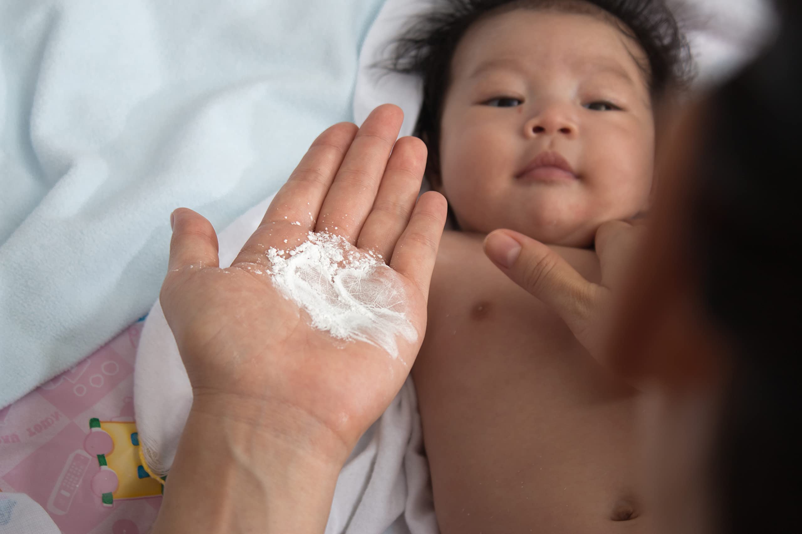 Safflower Safari Herbal Baby Powder texture closeup, talc-free formula feels silky on skin