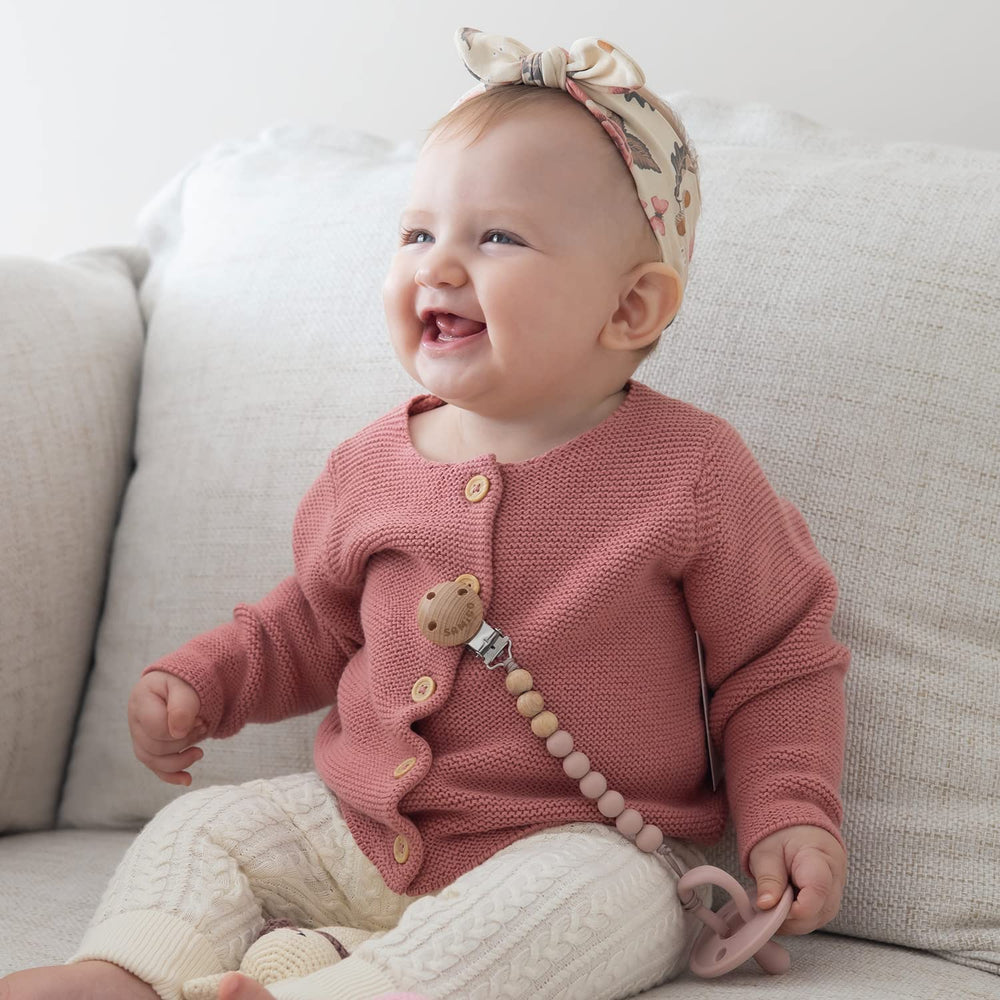 SAMiGO pacifier clips are lightweight and flexible for tiny little hands.